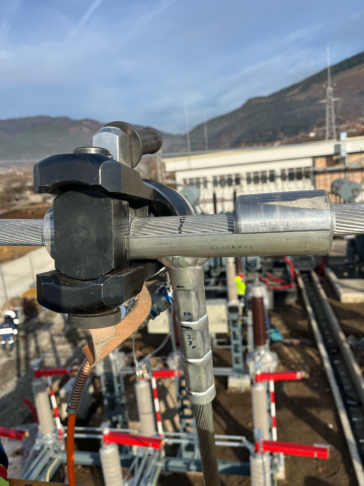 Bolted T-connector clamp on stranded aluminium overhead conductor at an outdoor substation