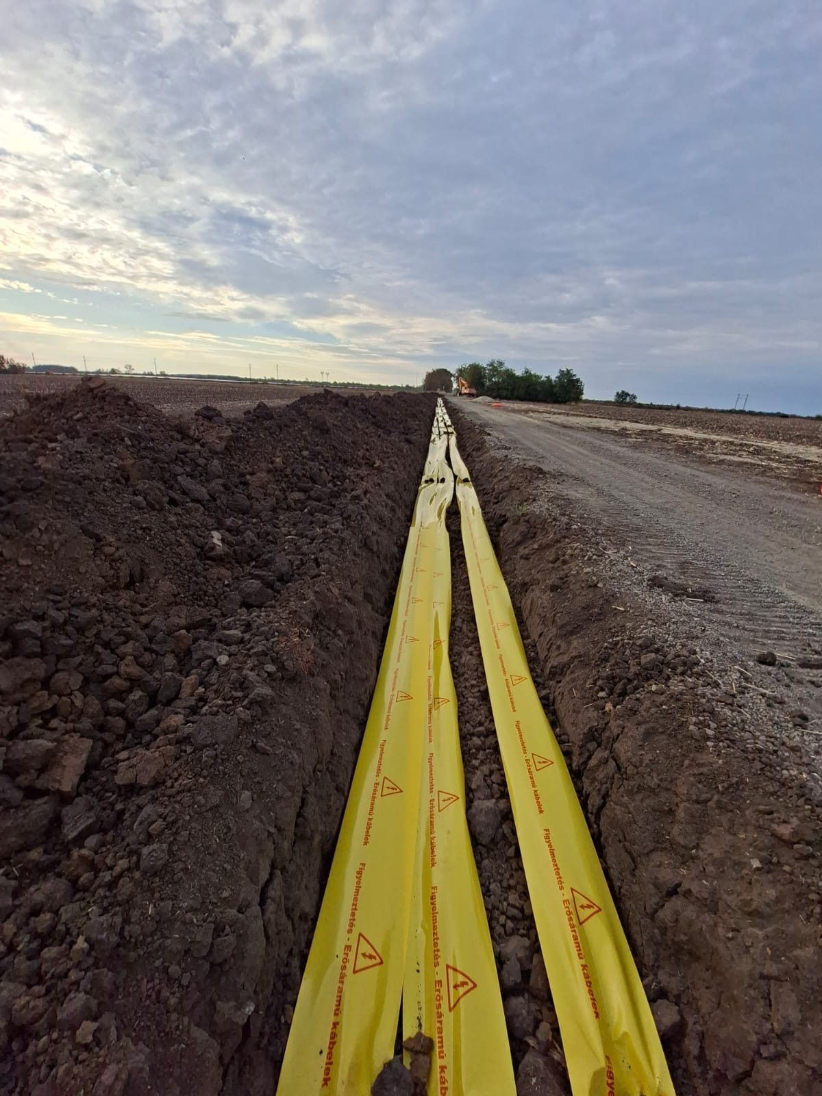 Cable warning tape laid over MV cable trench